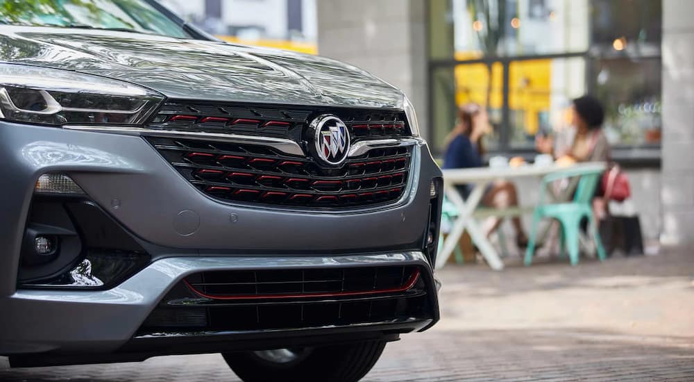 Close up on the grille of a silver 2022 Buick Encore GX.