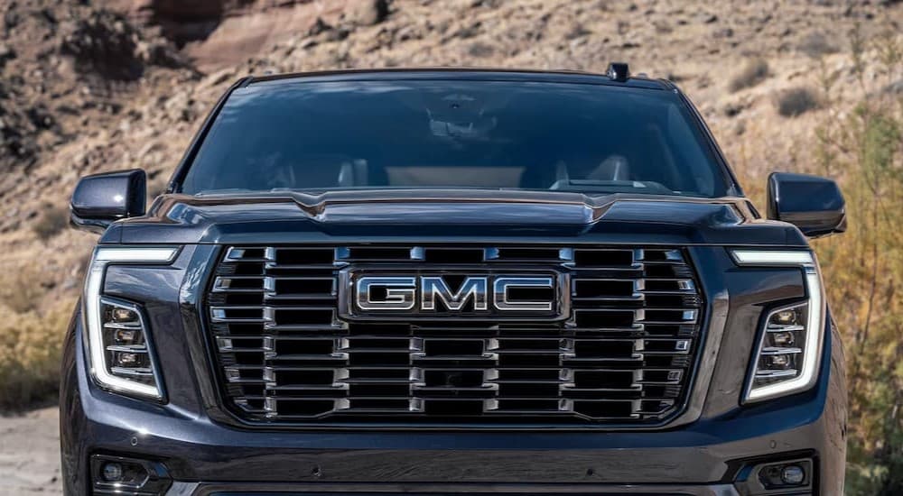 Close-up of the grille on a black 2025 GMC Yukon XL.