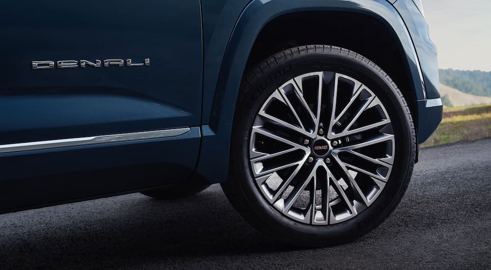 Close-up on the wheel of a dark blue 2026 GMC Terrain Denali.