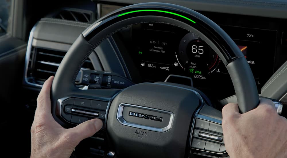 Steering wheel and digital gauge cluster in a 2025 GMC Sierra 1500