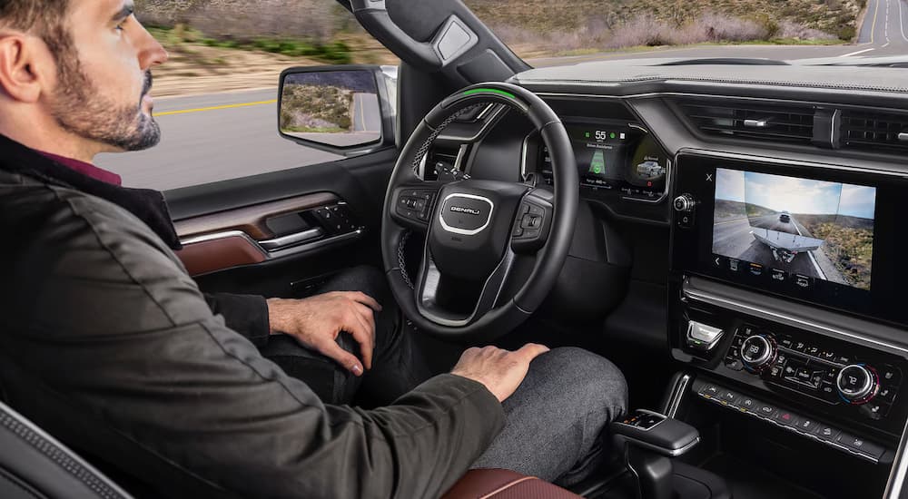 A man using Super Cruise in a 2025 GMC Sierra 1500