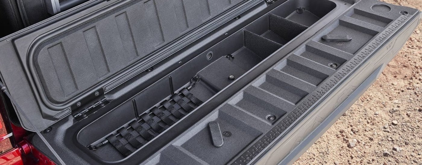 Tailgate storage on a red 2025 GMC Canyon