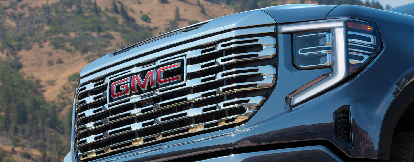 Chrome grille on a blue 2026 GMC Sierra 1500 Denali