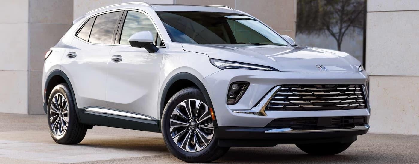 A white 2025 Buick Envision is parked at a Buick dealer near Ottawa.