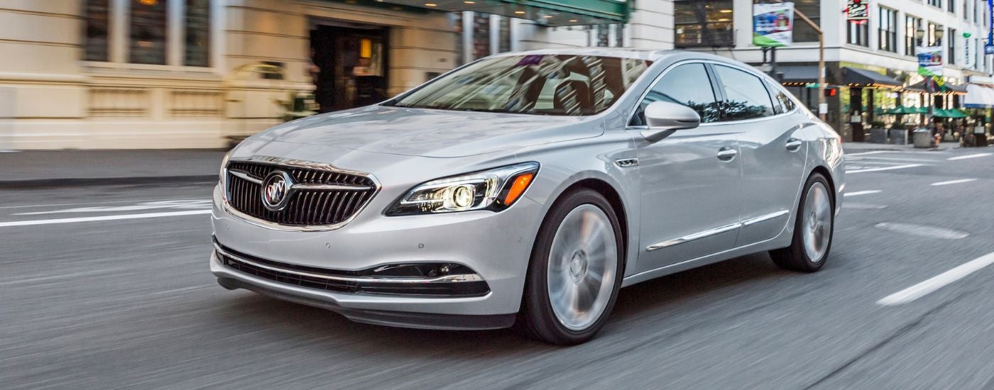 A white 2019 Buick LaCrosse driving through a city.